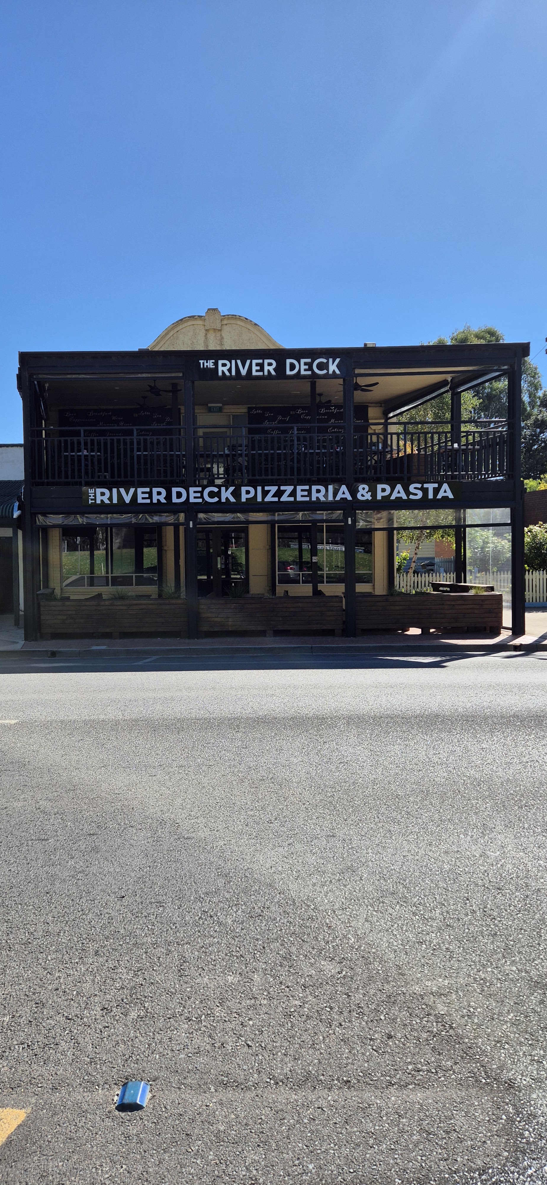 The River Deck Pizzeria & Pasta shopfront on Deniliquin Road, with the balcony upstairs
