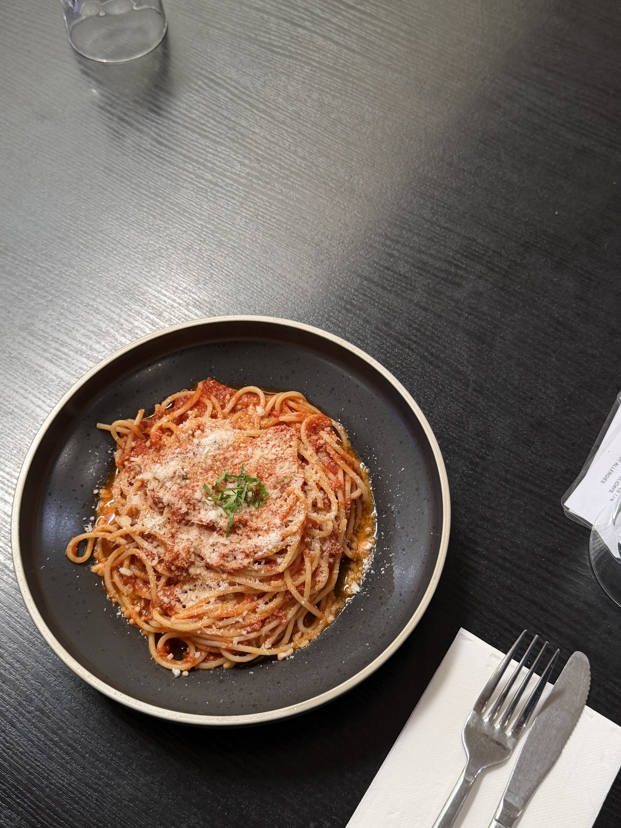 Spaghetti bolognese with parmesan and basil